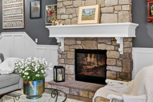 90 Cranbrook Hill Se, Calgary, AB - Indoor Photo Showing Living Room With Fireplace