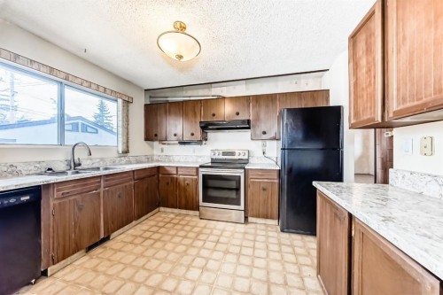 619 Maryvale Way Ne, Calgary, AB - Indoor Photo Showing Kitchen With Double Sink