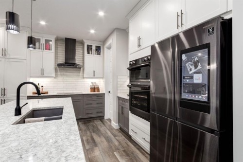 166 Osborne Common Sw, Airdrie, AB - Indoor Photo Showing Kitchen With Double Sink With Upgraded Kitchen