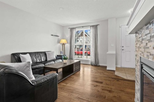 86 Elgin Meadows Gardens Se, Calgary, AB - Indoor Photo Showing Living Room With Fireplace