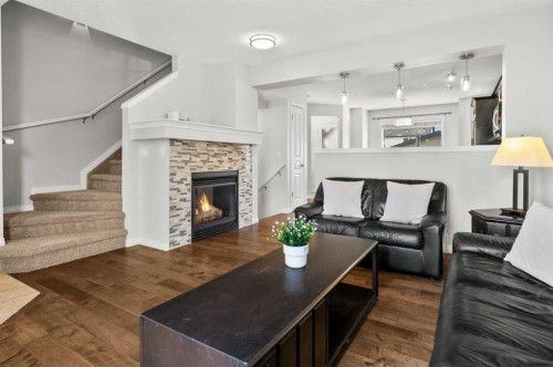 86 Elgin Meadows Gardens Se, Calgary, AB - Indoor Photo Showing Living Room With Fireplace