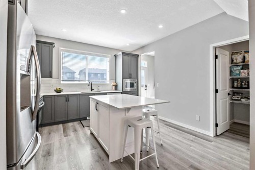 68 Wolf Gate, Okotoks, AB - Indoor Photo Showing Kitchen With Upgraded Kitchen