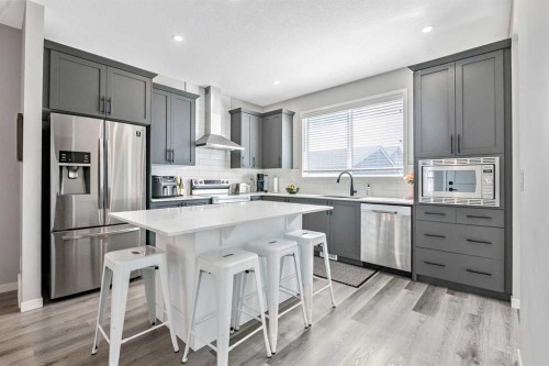 68 Wolf Gate, Okotoks, AB - Indoor Photo Showing Kitchen With Upgraded Kitchen
