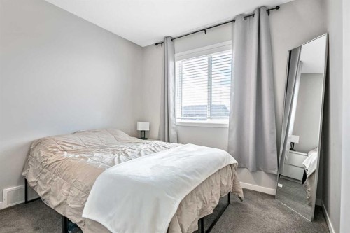 68 Wolf Gate, Okotoks, AB - Indoor Photo Showing Bedroom