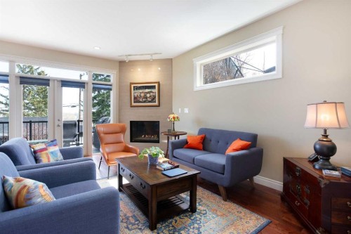 136 43 Avenue Nw, Calgary, AB - Indoor Photo Showing Living Room With Fireplace