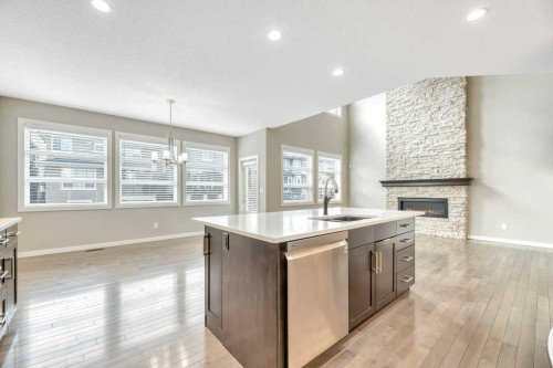 29 Aspen Summit Point Sw, Calgary, AB - Indoor Photo Showing Kitchen With Fireplace