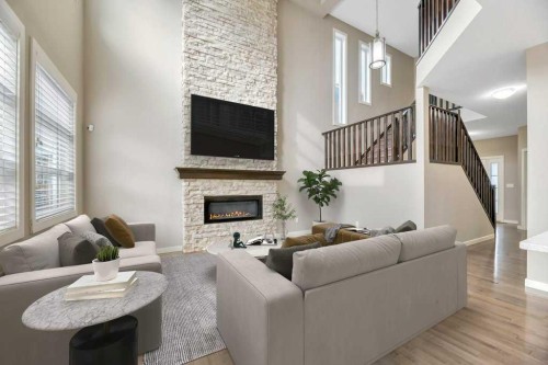 29 Aspen Summit Point Sw, Calgary, AB - Indoor Photo Showing Living Room With Fireplace
