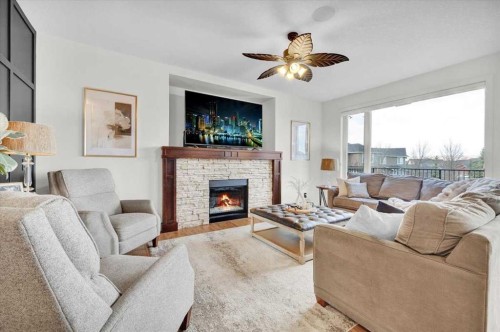 142 Fireside Bend, Cochrane, AB - Indoor Photo Showing Living Room With Fireplace