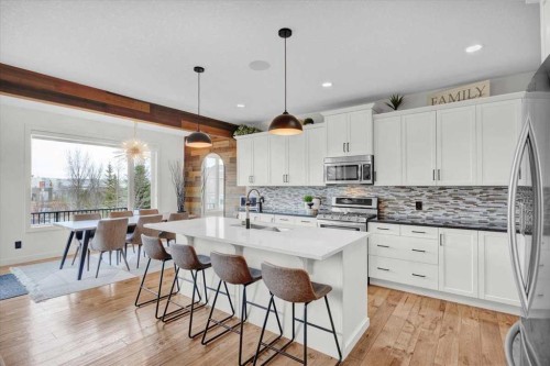 142 Fireside Bend, Cochrane, AB - Indoor Photo Showing Kitchen With Upgraded Kitchen