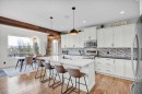 142 Fireside Bend, Cochrane, AB  - Indoor Photo Showing Kitchen With Upgraded Kitchen 