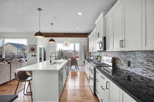 142 Fireside Bend, Cochrane, AB - Indoor Photo Showing Kitchen With Upgraded Kitchen