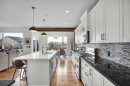 142 Fireside Bend, Cochrane, AB  - Indoor Photo Showing Kitchen With Upgraded Kitchen 