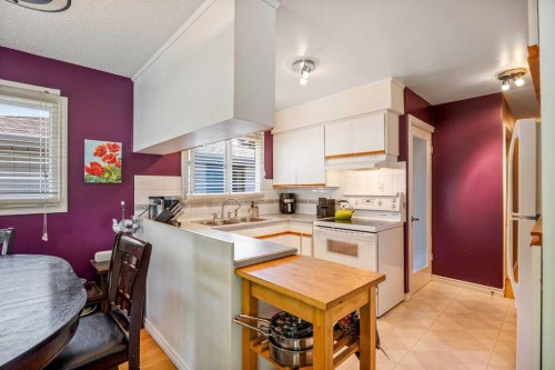 5 Fraser Road Se, Calgary, AB - Indoor Photo Showing Kitchen With Double Sink