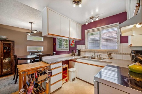 5 Fraser Road Se, Calgary, AB - Indoor Photo Showing Kitchen With Double Sink