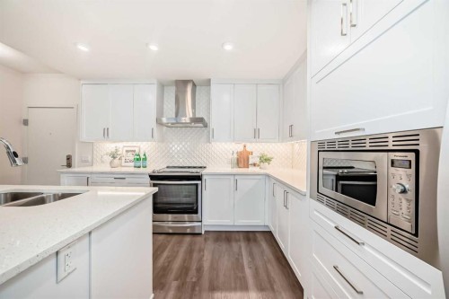 307-12 Mahogany Path Se, Calgary, AB - Indoor Photo Showing Kitchen With Stainless Steel Kitchen With Double Sink With Upgraded Kitchen