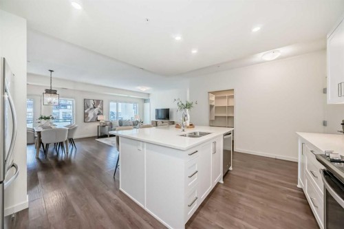 307-12 Mahogany Path Se, Calgary, AB - Indoor Photo Showing Kitchen With Double Sink With Upgraded Kitchen