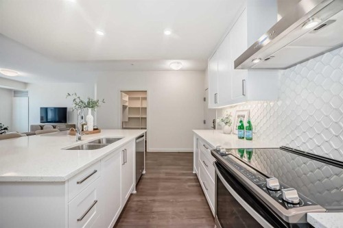 307-12 Mahogany Path Se, Calgary, AB - Indoor Photo Showing Kitchen With Double Sink With Upgraded Kitchen