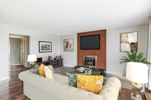 5636 37 Street Sw, Calgary, AB - Indoor Photo Showing Living Room With Fireplace