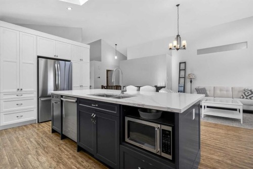811 Boulder Creek Drive Se, Langdon, AB - Indoor Photo Showing Kitchen With Stainless Steel Kitchen With Double Sink With Upgraded Kitchen