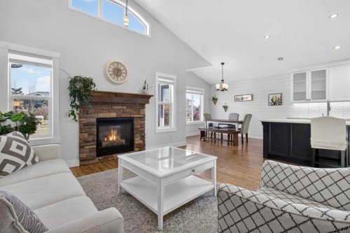 811 Boulder Creek Drive Se, Langdon, AB - Indoor Photo Showing Living Room With Fireplace