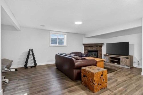 811 Boulder Creek Drive Se, Langdon, AB - Indoor Photo Showing Living Room With Fireplace