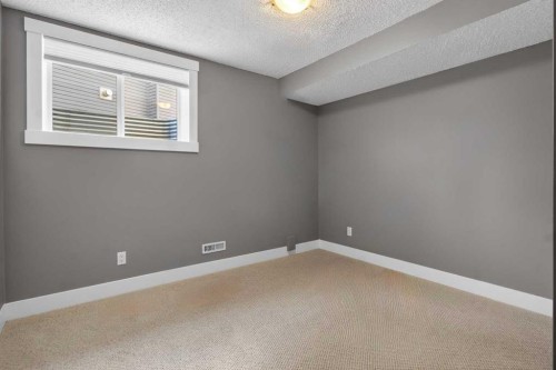 811 Boulder Creek Drive Se, Langdon, AB - Indoor Photo Showing Other Room