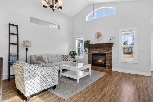 811 Boulder Creek Drive Se, Langdon, AB - Indoor Photo Showing Living Room With Fireplace