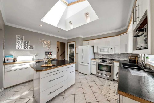 1441 Hunterbrook Road Nw, Calgary, AB - Indoor Photo Showing Kitchen With Double Sink