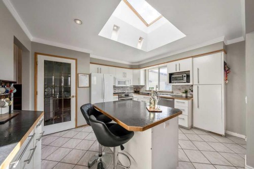 1441 Hunterbrook Road Nw, Calgary, AB - Indoor Photo Showing Kitchen With Double Sink