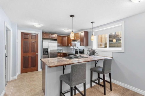 111 Shawglen Road Sw, Calgary, AB - Indoor Photo Showing Kitchen With Double Sink