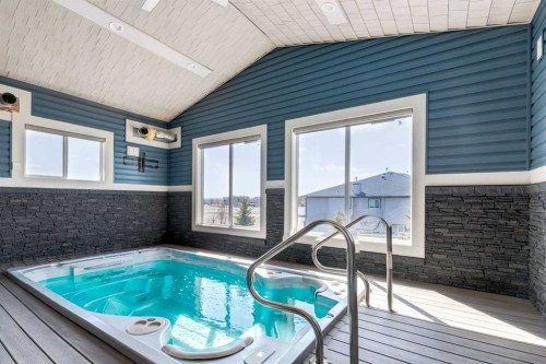 102 Speargrass Crescent, Carseland, AB - Indoor Photo Showing Other Room With In Ground Pool