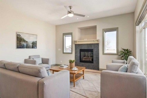 102 Speargrass Crescent, Carseland, AB - Indoor Photo Showing Living Room With Fireplace
