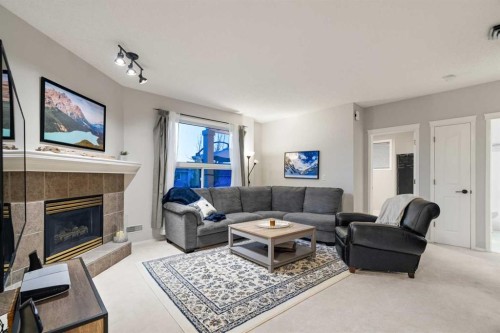 94 Edgebrook Heights Nw, Calgary, AB - Indoor Photo Showing Living Room With Fireplace
