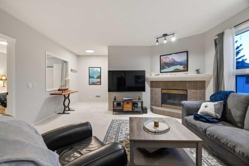 94 Edgebrook Heights Nw, Calgary, AB - Indoor Photo Showing Living Room With Fireplace