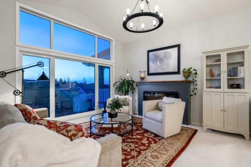 94 Edgebrook Heights Nw, Calgary, AB - Indoor Photo Showing Living Room With Fireplace