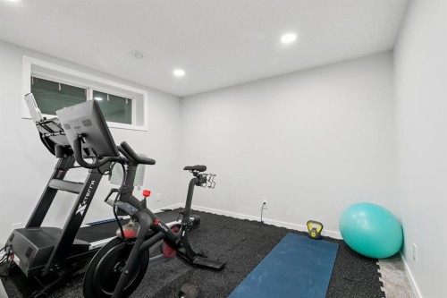 80 Brightoncrest Point Se, Calgary, AB - Indoor Photo Showing Gym Room