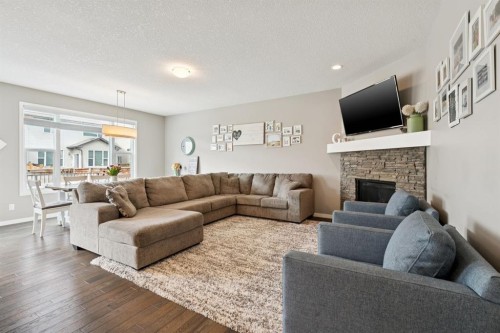 80 Brightoncrest Point Se, Calgary, AB - Indoor Photo Showing Living Room With Fireplace