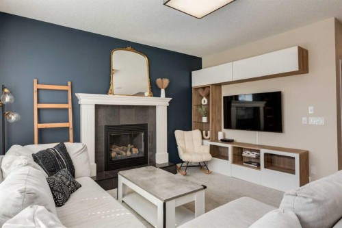 152 Brightoncrest Manor Se, Calgary, AB - Indoor Photo Showing Living Room With Fireplace