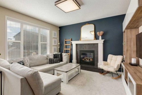 152 Brightoncrest Manor Se, Calgary, AB - Indoor Photo Showing Living Room With Fireplace
