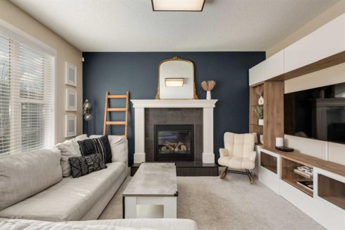 152 Brightoncrest Manor Se, Calgary, AB - Indoor Photo Showing Living Room With Fireplace