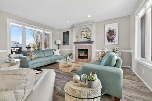 7 Henderson Bay Ne, Langdon, AB - Indoor Photo Showing Living Room With Fireplace