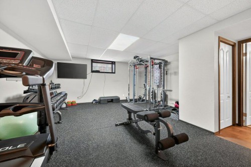 7 Henderson Bay Ne, Langdon, AB - Indoor Photo Showing Gym Room