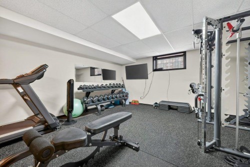 7 Henderson Bay Ne, Langdon, AB - Indoor Photo Showing Gym Room