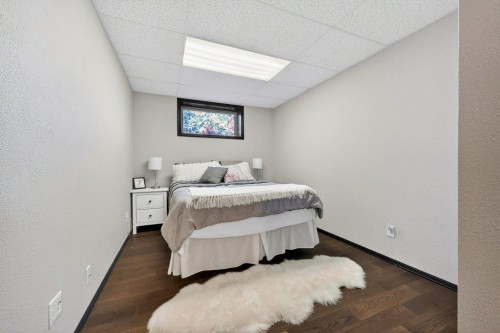 7 Henderson Bay Ne, Langdon, AB - Indoor Photo Showing Bedroom