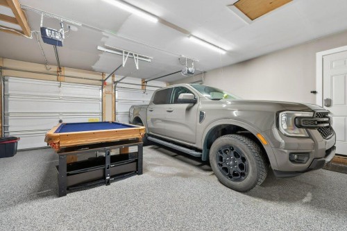 7 Henderson Bay Ne, Langdon, AB - Indoor Photo Showing Garage