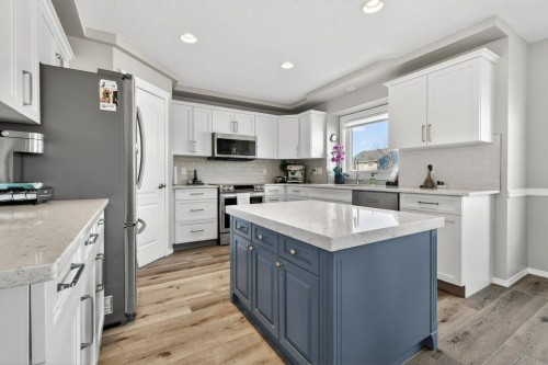 7 Henderson Bay Ne, Langdon, AB - Indoor Photo Showing Kitchen With Upgraded Kitchen