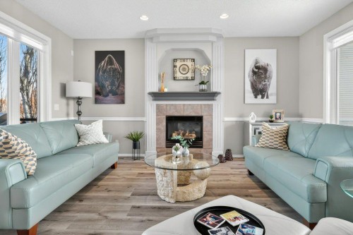 7 Henderson Bay Ne, Langdon, AB - Indoor Photo Showing Living Room With Fireplace