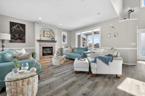 7 Henderson Bay Ne, Langdon, AB - Indoor Photo Showing Living Room With Fireplace