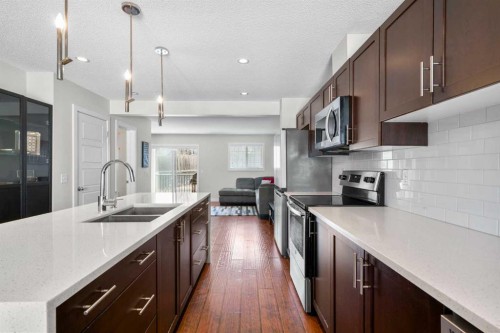 89 Pantego Lane Nw, Calgary, AB - Indoor Photo Showing Kitchen With Stainless Steel Kitchen With Double Sink With Upgraded Kitchen