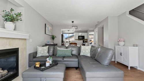 95 Elgin Meadows View Se, Calgary, AB - Indoor Photo Showing Living Room With Fireplace